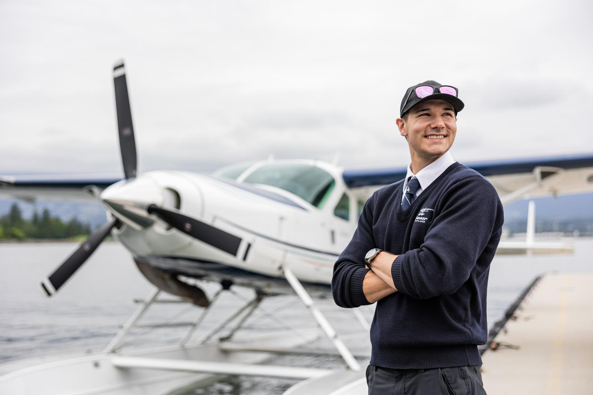 Smiling pilot ready to welcome you aboard