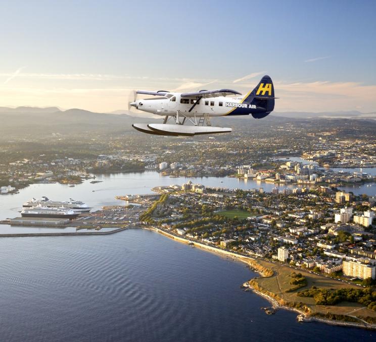 A Harbour Air Seaplanes flight soars into Victoria, BC's Inner Harbour
