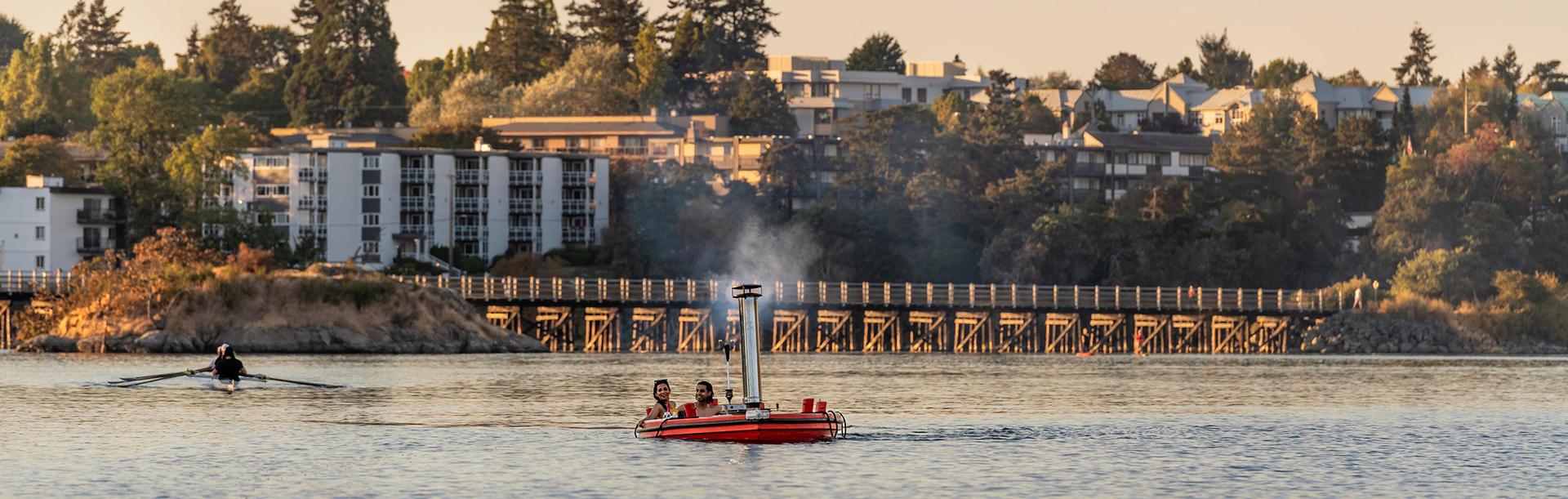 A Hot Tub Boat from Hot Tub Boat Victoria sails across the Gorge Waterway in Victoria, BC