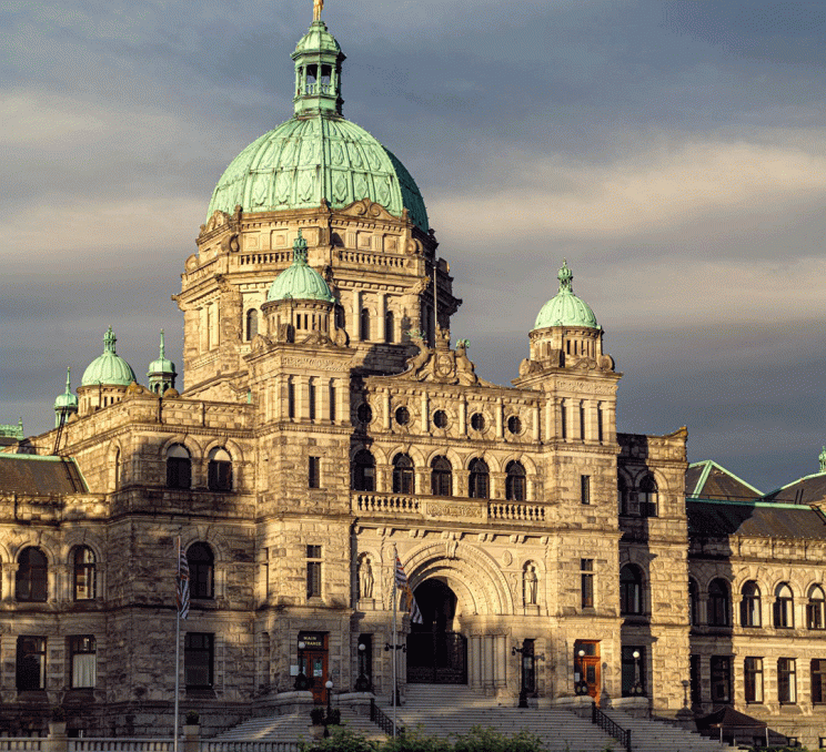 The BC Parliament Buildings at sunrise located on Victoria BC's Inner Harbour