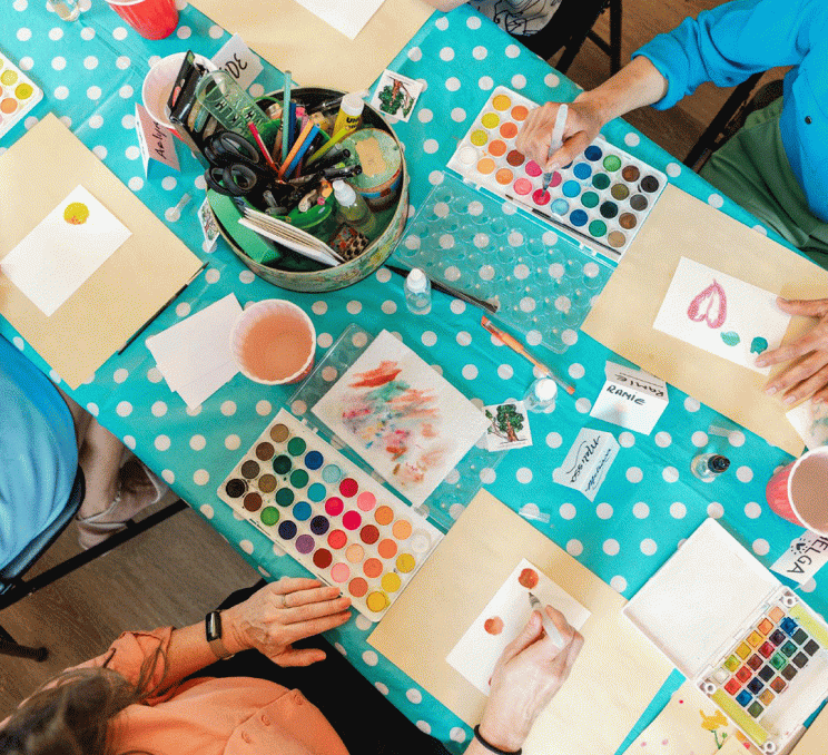 A group of people painting during a workshop at Emily Carr House, a National Historic Site, and birthplace of famed Canadian artist and author, Emily Carr, in Victoria, BC