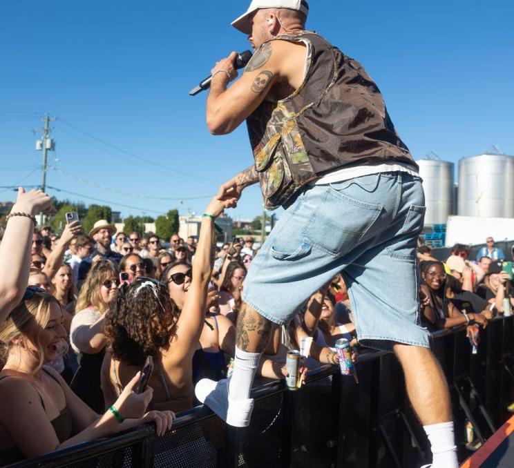 A performer on stage at the Phillips Backyard Music Festival in Victoria, BC