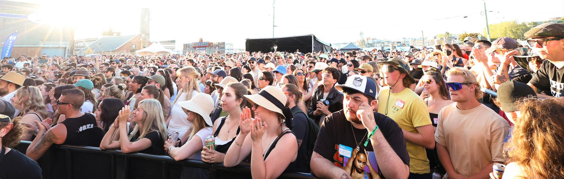 A crowd of onlookers watches a performance at the Phillips Backyard Music Festival in Victoria, BC