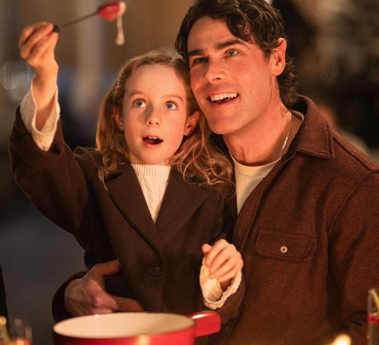 A father and daughter share a fondue on the Veranda at the Fairmont Empress during the holiday season in Victoria, BC