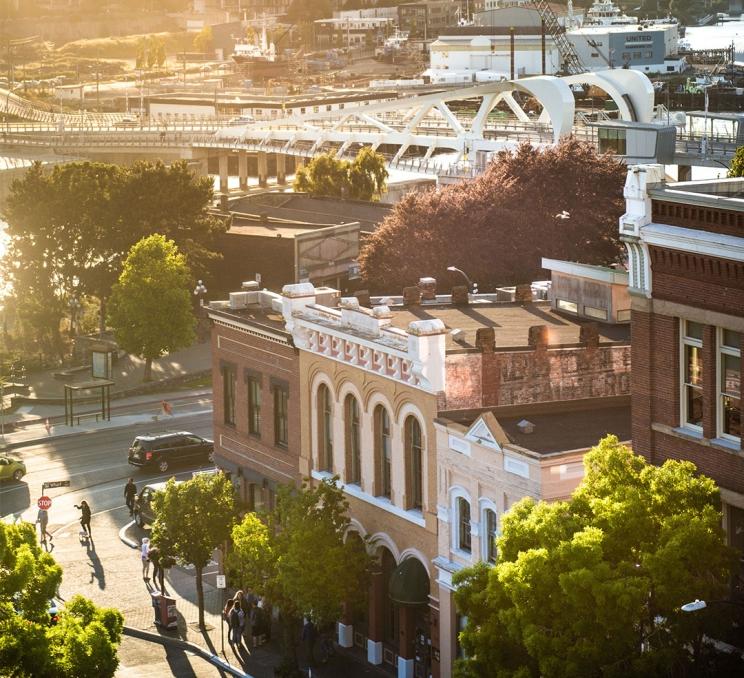 A view down Yates Street toward the Johnson Street Bridge at sunrise in Victoria, BC