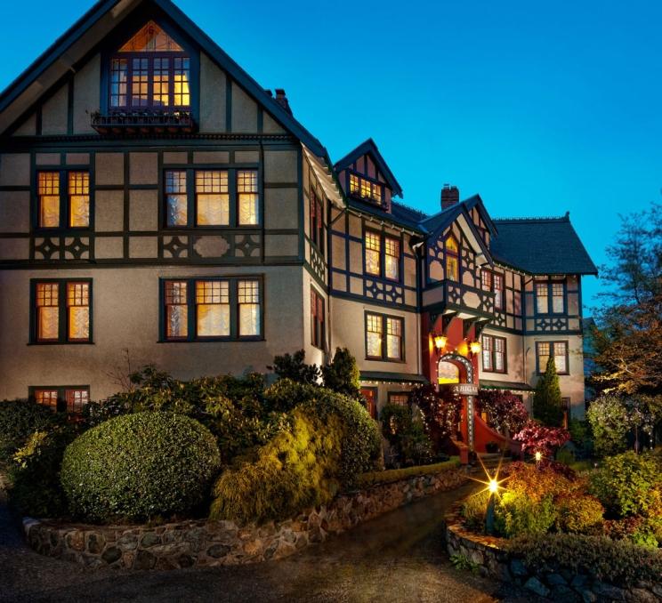 Abigail's Hotel illuminated at dusk in Victoria, BC