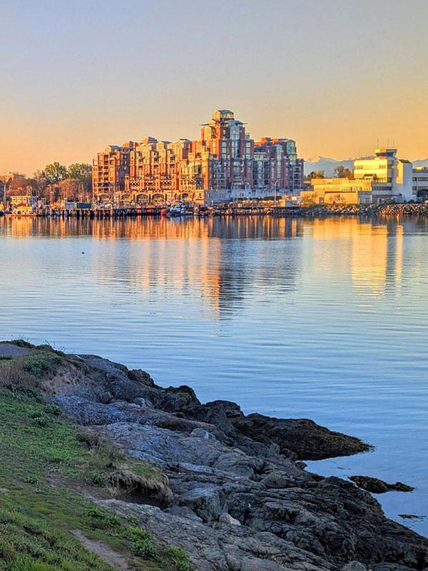 A view of a building across the Harbour from the Vic West neighbourhood of Victoria, BC