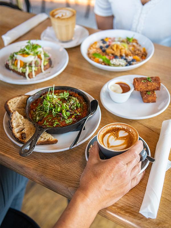 A spread of brunch items on a table in a restaurant in Victoria, BC