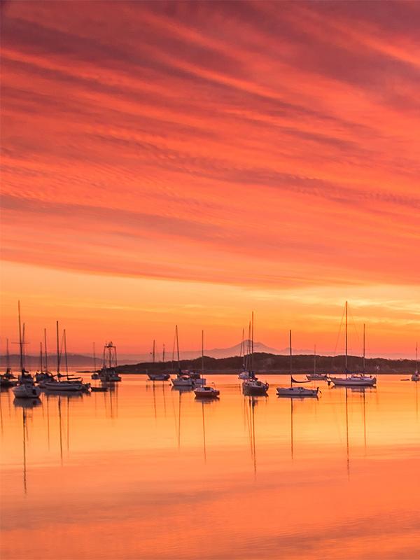 A sunrise above Oak Bay Marina shows off its fiery hues in Victoria, BC