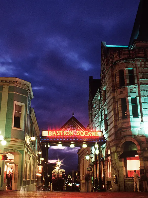 The entrance way to Bastion Square illuminated on an evening in Victoria, BC