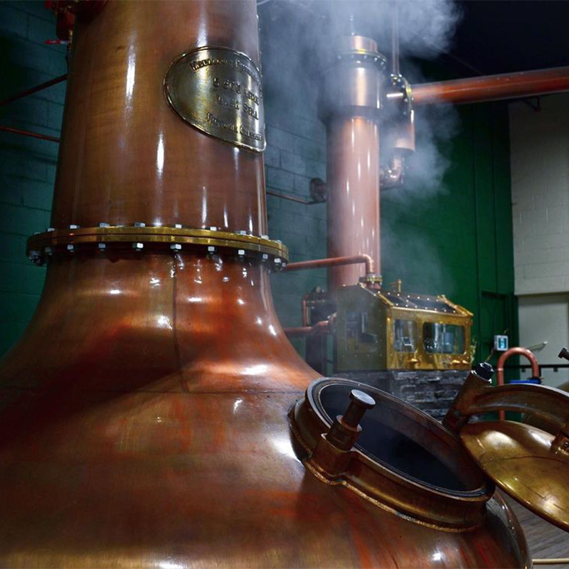 The Forsyth's copper pot stills in Action at Macaloney's Caledonian Distillery