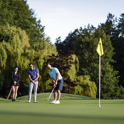A group of professionals golfing at a Victoria, BC golf course