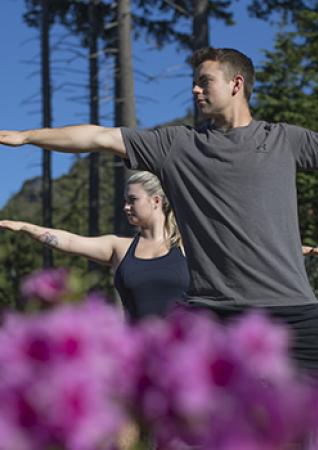 Couple doing yoga at Bear Moutain
