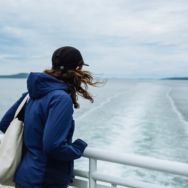 A Woman in a Blue Jacket Enjoys the Views on a B.C. Ferries Ride